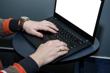 hands on the laptop keyboard and blank screen