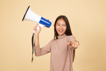 Beautiful young Asian woman announce with megaphone.