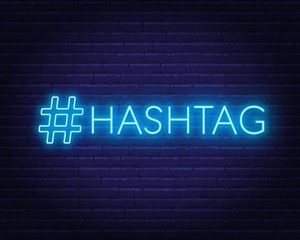 Neon hashtag sign on brick wall background. Vector illustration.