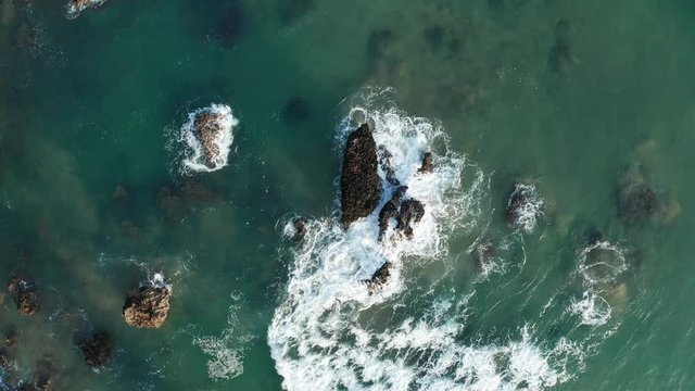 Sea waves breaking in the reefs of the coast in Sonabia #104, Spain, Cantabrian sea - drone aerial 4k footage graded (ungraded version available)