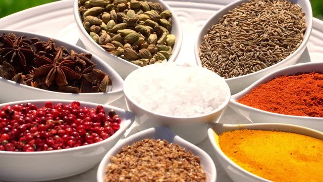 Spices. Various Indian. Spice and herbs rotate. Assortment of Seasonings, condiments. Cooking ingredients, flavor. 4K video Beautiful view
