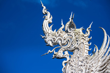 Decoration on top of roof at Wat Rong Khun Chiang Rai province Thailand.