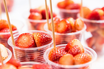 Sliced strawberry in plastic glasses are ready to eat.Thailand.