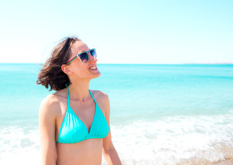 girl smiling near the ocean