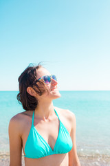 girl smiling near the ocean