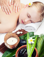 Obraz na płótnie Canvas Spa massage. Top view. Beautiful young woman getting spa massage