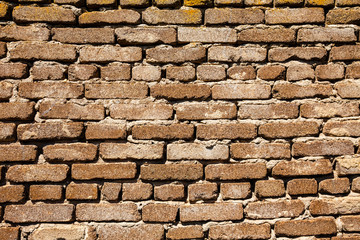 Horizontal wall texture of several rows of old bricks