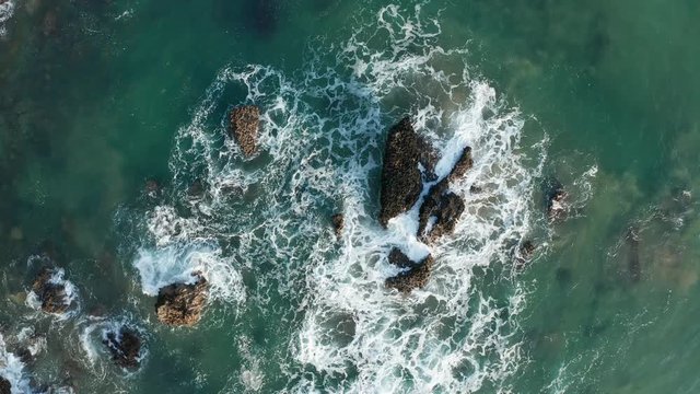 Sea waves breaking in the reefs of the coast in Sonabia #060, Spain, Cantabrian sea - drone aerial 4k footage graded (ungraded version available)