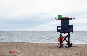 guard house with green flag of lifeguards on a Spanish beach