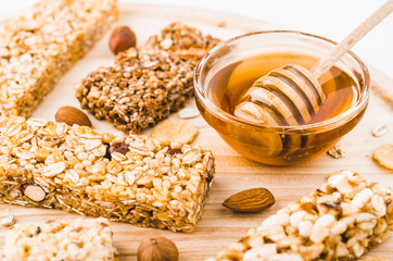 Museli, cereal, granola protein energy bars and honey