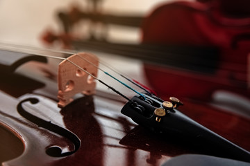 Closeup the violin front side,focus at the Fine Tuners,vintage and art tone,classic style,blurry light around