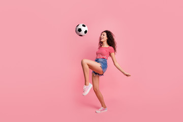 Full length body size view portrait of her she nice-looking attractive lovely cheerful cheery wavy-haired girl playing with ball isolated over pink pastel background