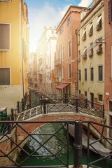 Fototapeta na wymiar brige through canal waters of Venice Italy