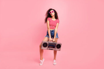 Full length body size view portrait of her she nice attractive lovely cool charming cheerful cheery wavy-haired lady carrying player night club clubber isolated over pink pastel background