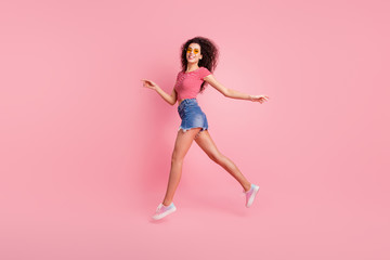 Fototapeta na wymiar Profile side full length body size view portrait of nice lovely attractive perfect sportive shape form figure cheerful cheery wavy-haired lady jogging strolling isolated over pink pastel background