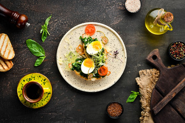 Sandwich with spinach, egg and tomatoes. croissant. Breakfast. In the plate. Top view. Flat lay composition Free copy space.