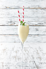 Tropical cocktail with coconut milk and banana. Top view.