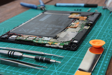 disassembled tablet tools on the table