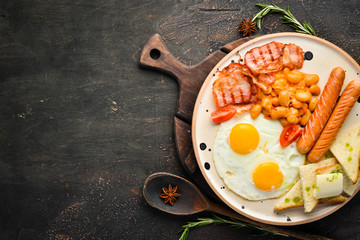 English breakfast in the plate. Top view. Free space for your text.