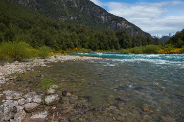 River Futaleufu flowing through a forested valley in the Region of southern Chile. The river is renowned as one of the premier locations in the world for white water rafting.