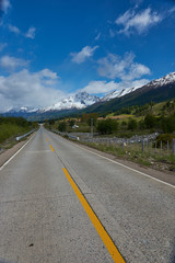 The Carretera Austral; famous road connecting remote towns and villages in northern Patagonia, Chile. Paved section of road running past snow capped mountains near the small town of Cerro Castillo.