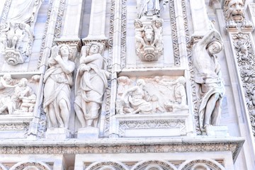 Beautiful Marble Facades of Duomo di Milano with Religious Statues