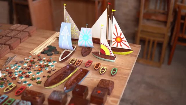 Small wooden boats and ships on carpenter's table