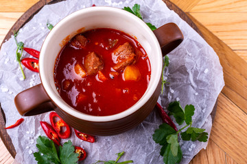 Goulash soup bograch in a bowl. Hungarian dish. Top view