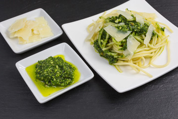 spaghetti pasta with pesto of ramson - wild garlic - with parmesan cheese and pine nuts
