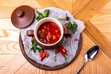 Tasty Hungarian Hot Goulash Soup Bograch or Gulas Lamb Meat Stew on Wooden Surface at Restaurant. Traditional Food.