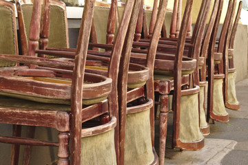 Fototapeta na wymiar Piled up chairs