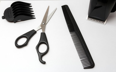 set of scissors and comb, hair clipper isolated on white
