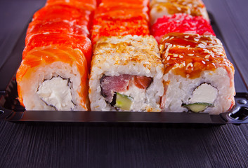 Various kinds of sushi served on a table