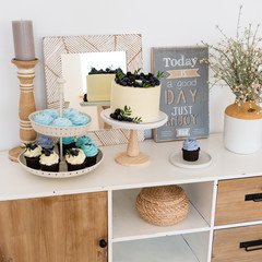 Candy bar. Table with sweets, candies, dessert. Boho style. Birthday, wedding party. Confectionery, bakery concept