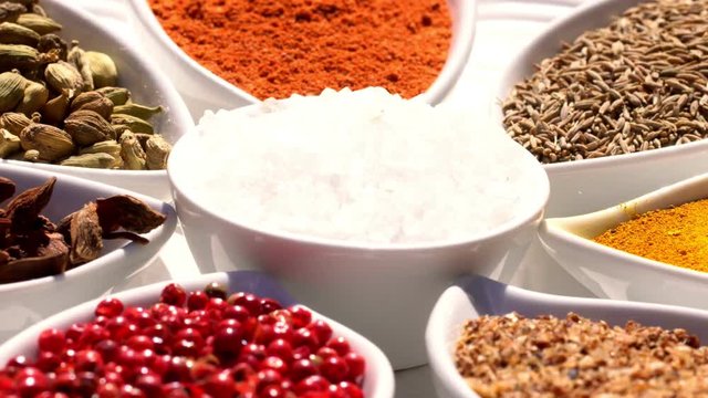 Spices. Various Indian. Spice and herbs rotate. Assortment of Seasonings, condiments. Cooking ingredients, flavor. 4K video Beautiful view