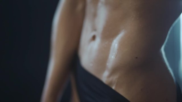 Abdomen muscles of young woman, shallow depth field