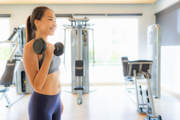 Fototapeta premium Portrait asian woman exercising and work out in gym