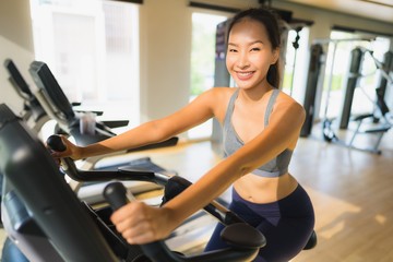 Fototapeta na wymiar Portrait asian woman exercising and work out in gym