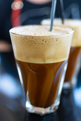 Traditional greek cold coffee Frappe made from water, instant coffee and ice cubes