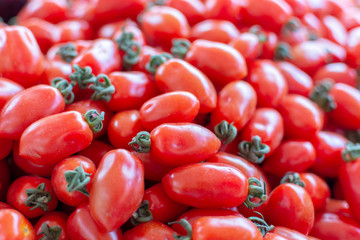 Red ripe tomatoes on farmets market close up