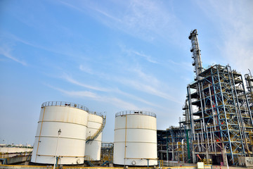 Big white gasoline and oil industry and the background of blue sky white clouds in the refinery of storage tanks