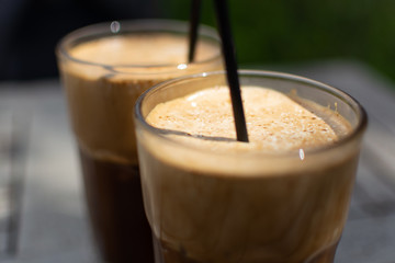 Traditional greek cold coffee Frappe made from water, instant coffee and ice cubes