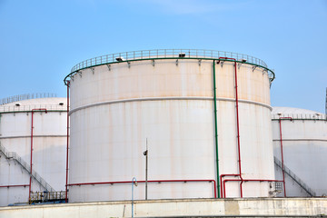 Big white gasoline and oil industry of storage tanks in the blue sky white cloud background