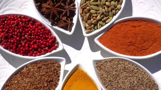 Spices. Various Indian. Spice and herbs rotate. Assortment of Seasonings, condiments. Cooking ingredients, flavor. 4K video Beautiful view