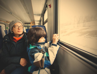 Mother and son in a railway carriage