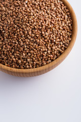 Grain buckwheat on a white acrylic background