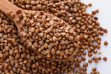 Grain buckwheat on a white acrylic background