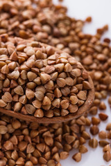 Grain buckwheat on a white acrylic background