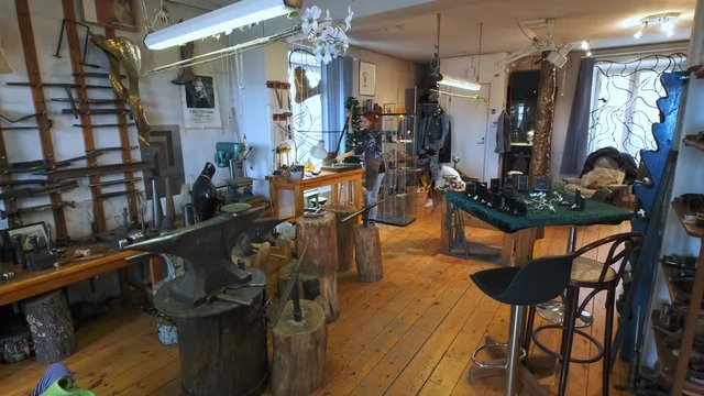 A Silversmith Working Hard In Her Workshop.