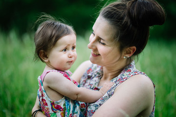 Mum looking happily at child